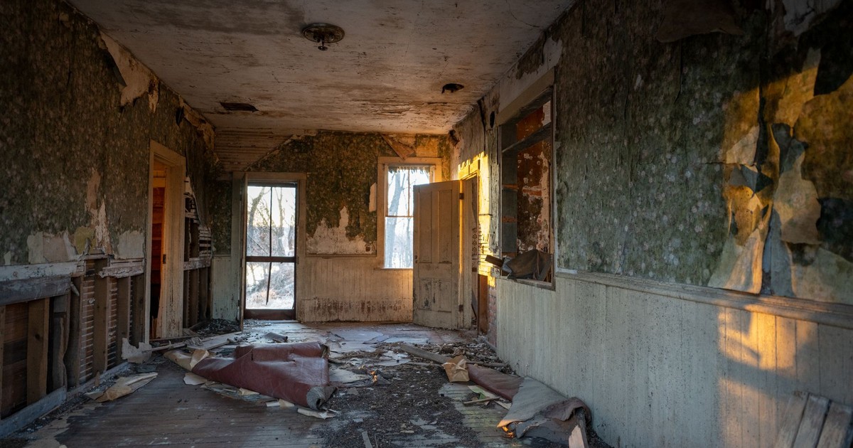 An old abandoned room in West Newton, Minnesota, illuminated by sunset light.
