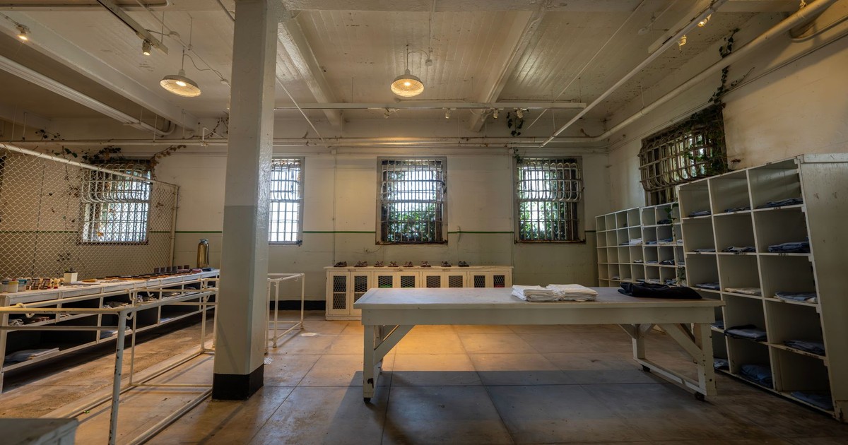 Explore the vintage interior of Alcatraz prison with barred windows and historical charm.