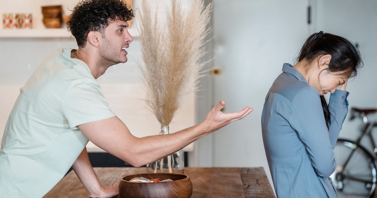 An intense argument between a couple indoors, depicting emotional distress and communication issues.