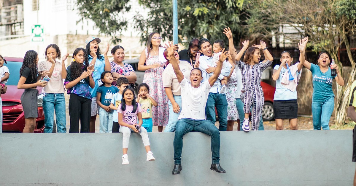 A diverse group enjoying a lively outdoor celebration, capturing the essence of a joyful family gathering.