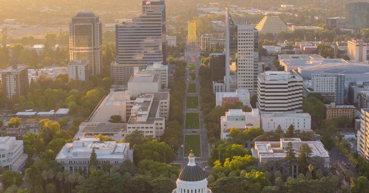 A stunning aerial view of Sacramento, California at sunrise with a focus on the Capitol building.
