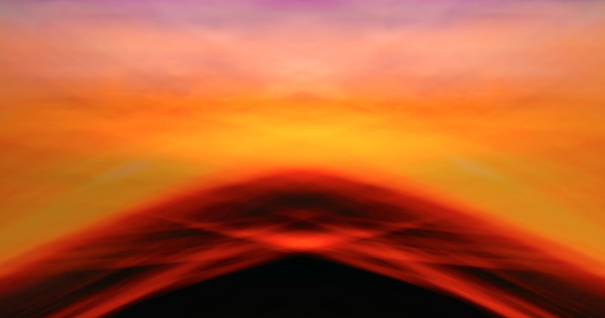 A vivid blend of colors in an abstract sunset sky, capturing a dreamy horizon.