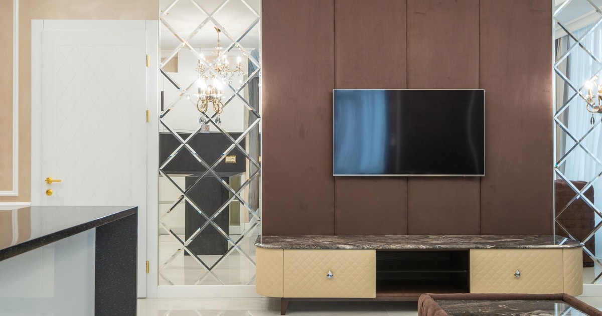 Sophisticated living room featuring elegant TV wall with stylish furniture.