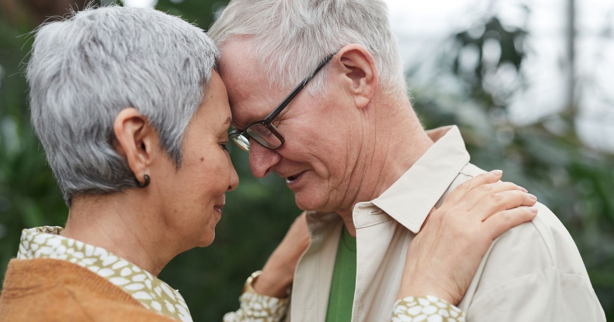 Senior couple sharing a tender moment together, showcasing love and affection.