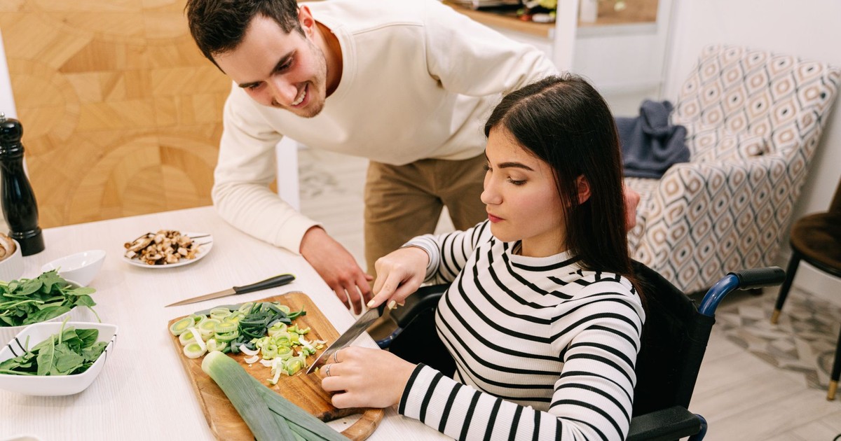 A couple cooking together, highlighting inclusivity and togetherness in the kitchen.