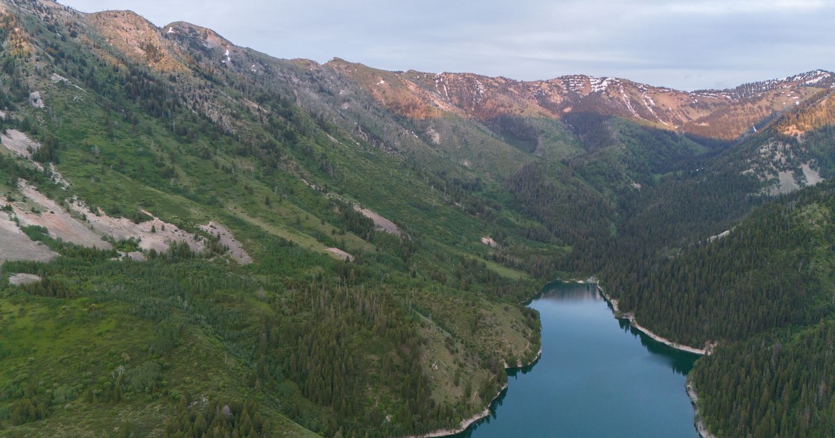 Experience the breathtaking beauty of Irwin, Idaho with its lush green valleys and serene river pathways.