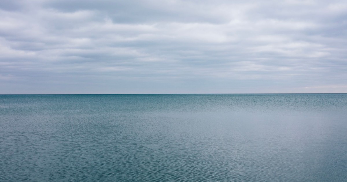 Tranquil winter scene of Lake Huron with overcast sky in Michigan, USA.