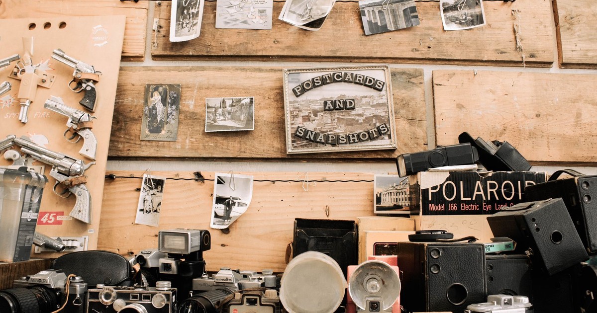 A nostalgic display of vintage cameras and memorabilia in an antique shop setting.