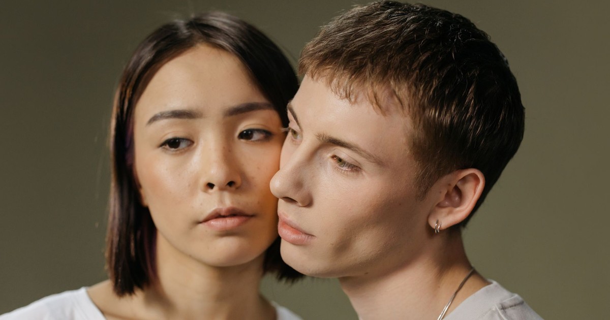 Close-up portrait of a thoughtful couple with an intimate connection.