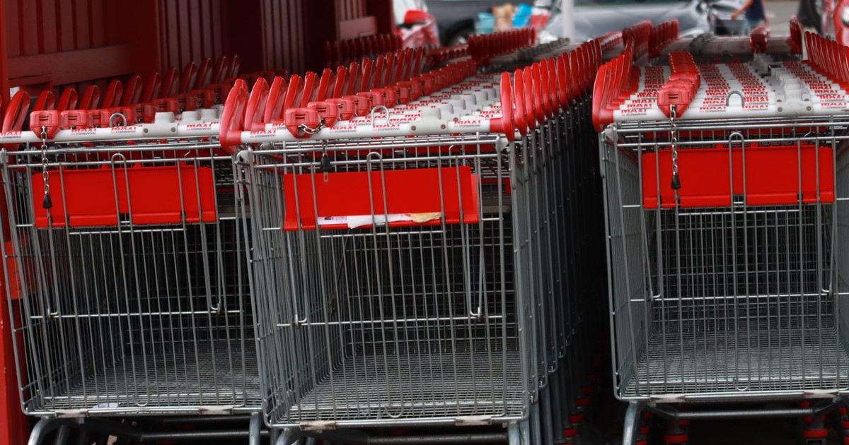 Rows of metal shopping carts in a store parking lot in Jönköping, Sweden.
