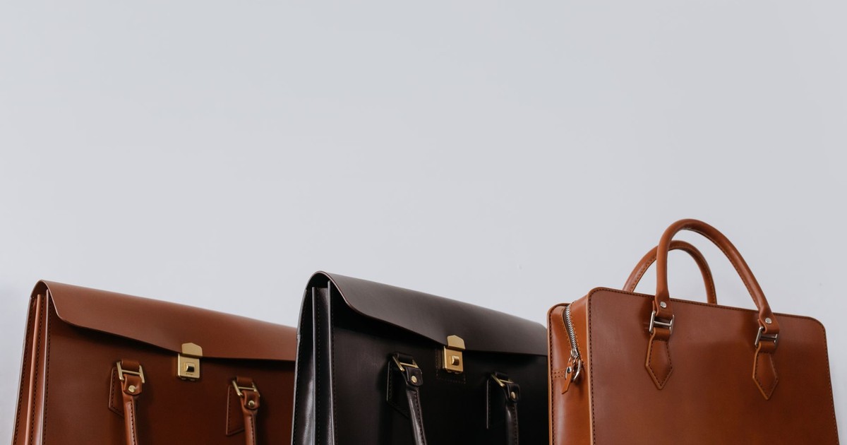 A close-up view of three elegant leather briefcases emphasizing luxury and fashion.