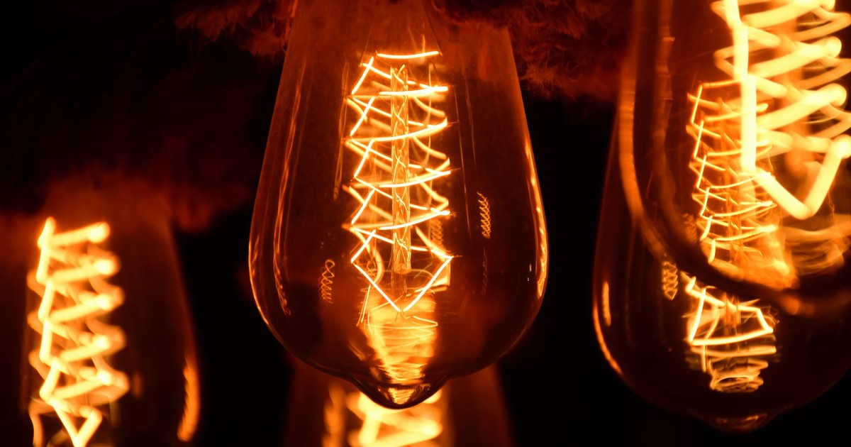 A close-up image of glowing vintage Edison light bulbs showcasing intricate filaments.
