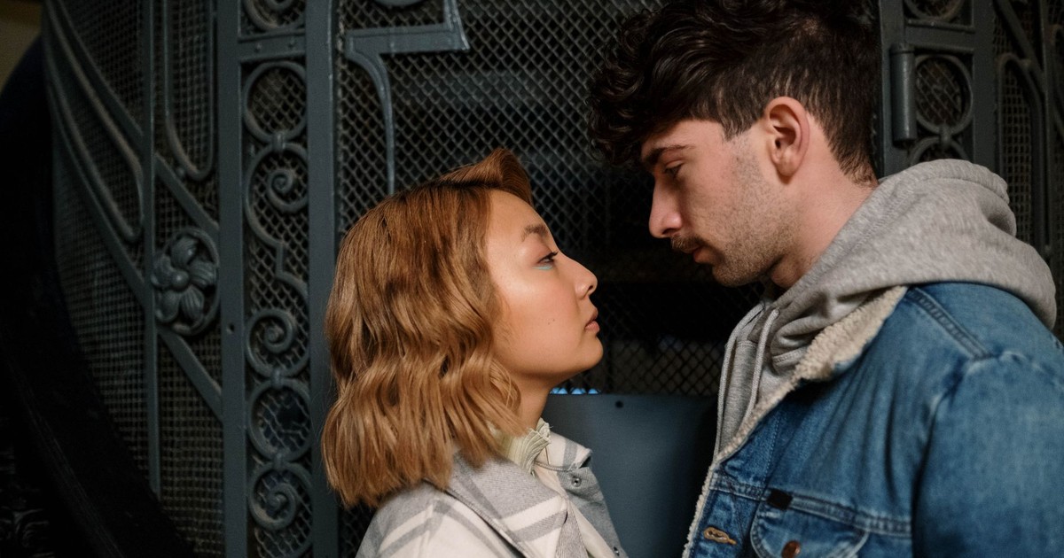 A couple sharing an intimate moment indoors, showcasing love and connection.