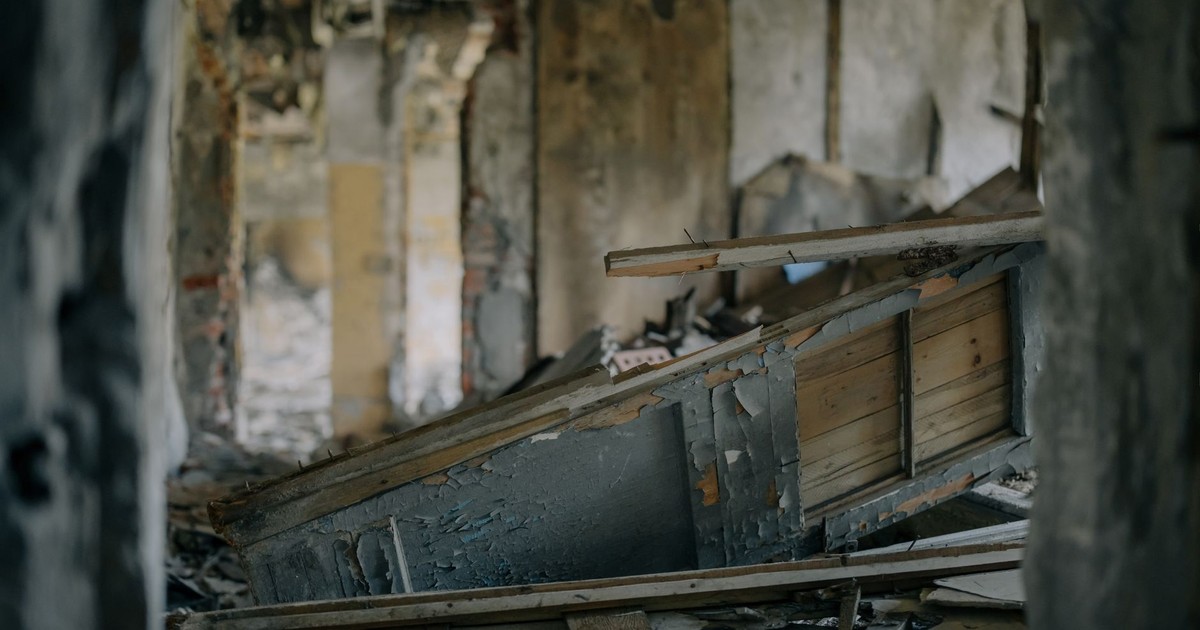Explore the eerie charm of an abandoned urban ruin, filled with decay and scattered debris.