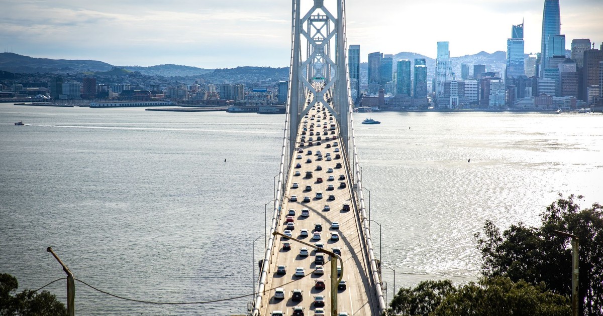 A stunning view of the Bay Bridge leading into San Francisco's iconic skyline.
