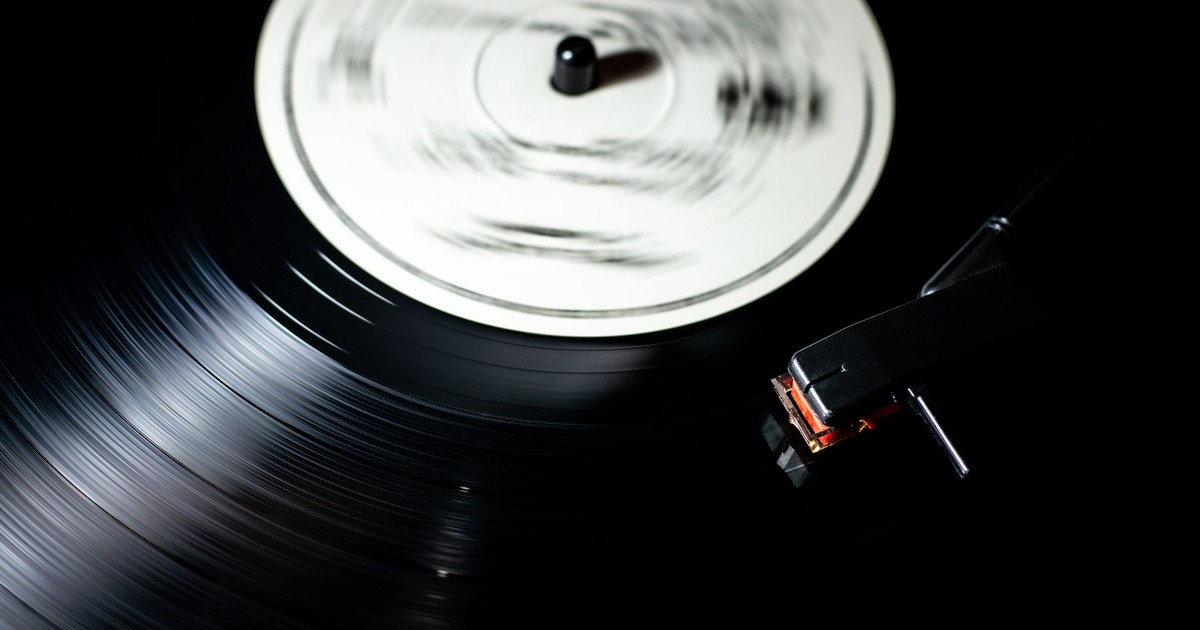 Close-up of a vintage vinyl record spinning on a turntable.