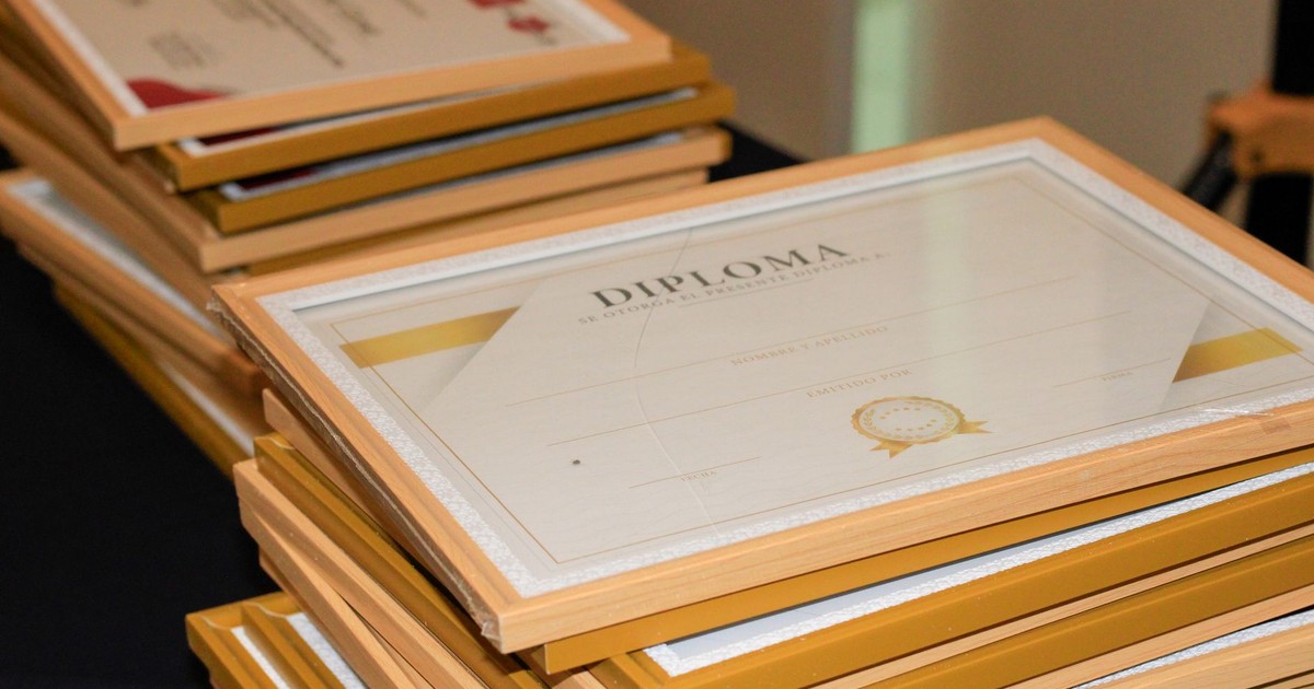 A stack of elegant framed diplomas prepared for an academic ceremony.