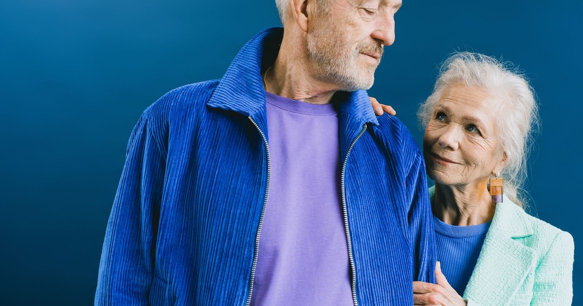 An affectionate elderly couple gazing at each other, symbolizing love and companionship.
