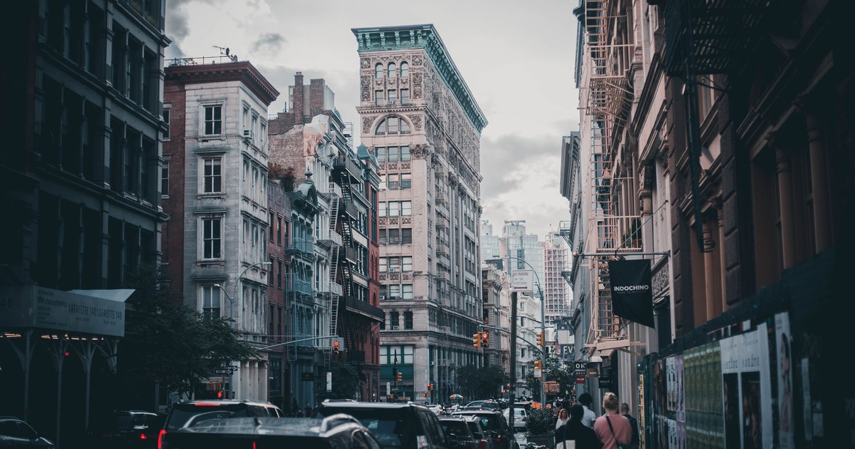 Urban scene capturing traffic and pedestrians in historic Soho, NYC.