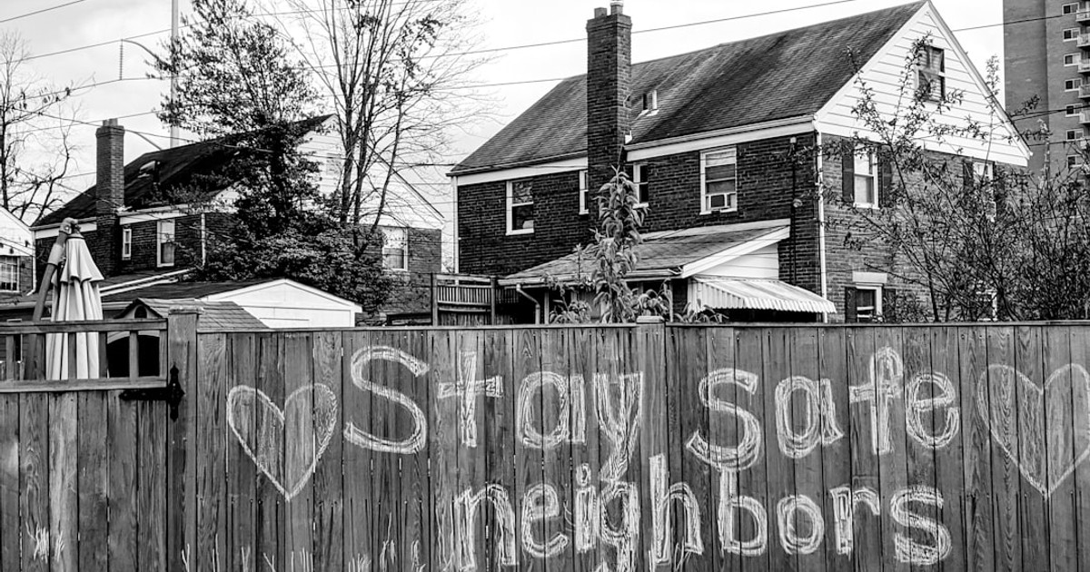 grayscale photo of wooden fence