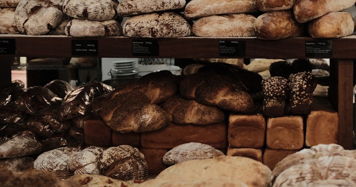 baked breads on brown wooden rack