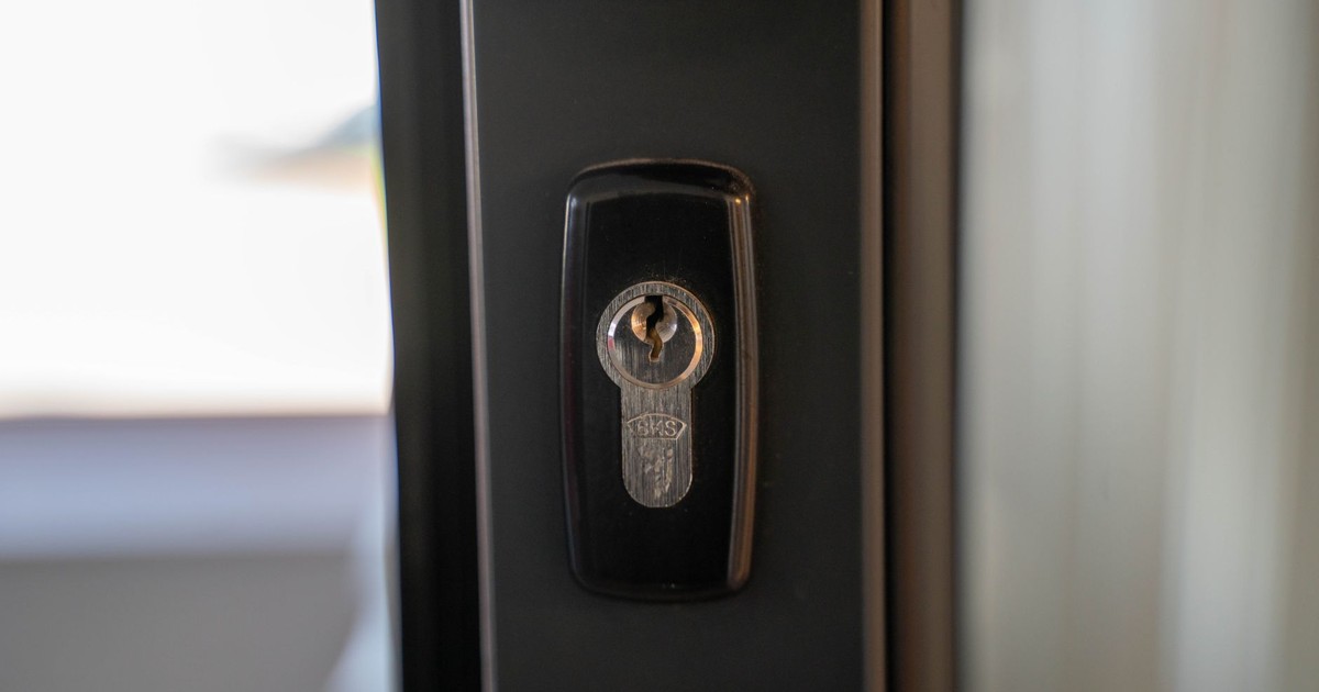 Detailed view of a steel keyhole on a door ensuring security and privacy.