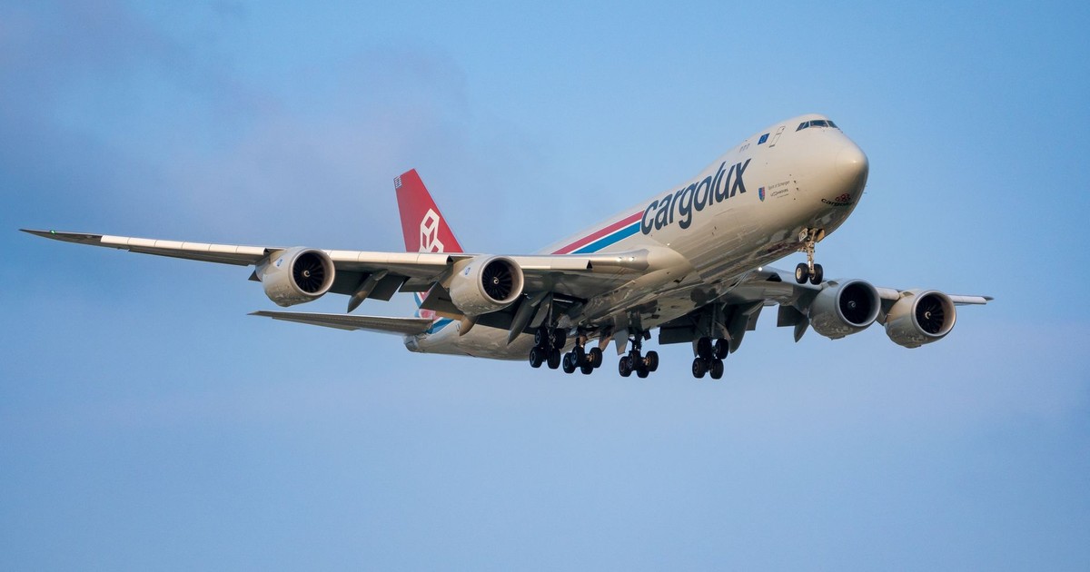 A Cargolux Boeing 747 airplane in-flight against a clear blue sky, showcasing aviation and air transport.
