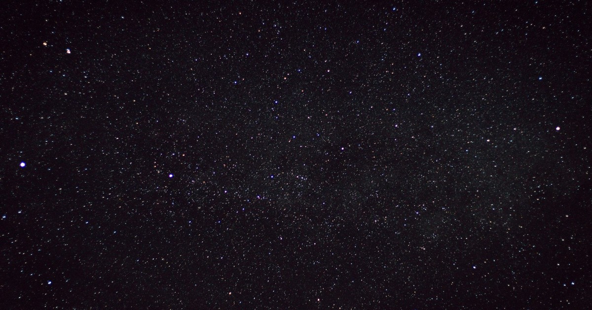 A clear starry night sky captured over the countryside in Germany, showcasing countless stars.