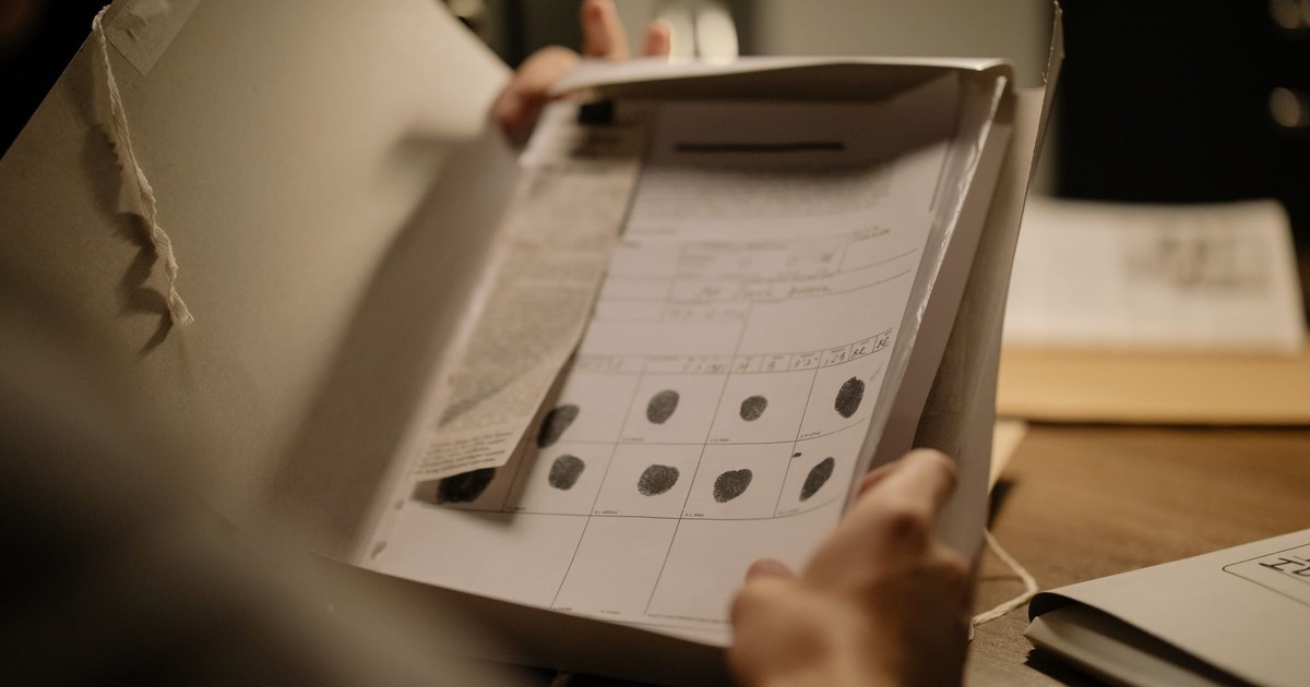Detailed image showcasing a fingerprint document in an open folder, ideal for forensic and legal themes.