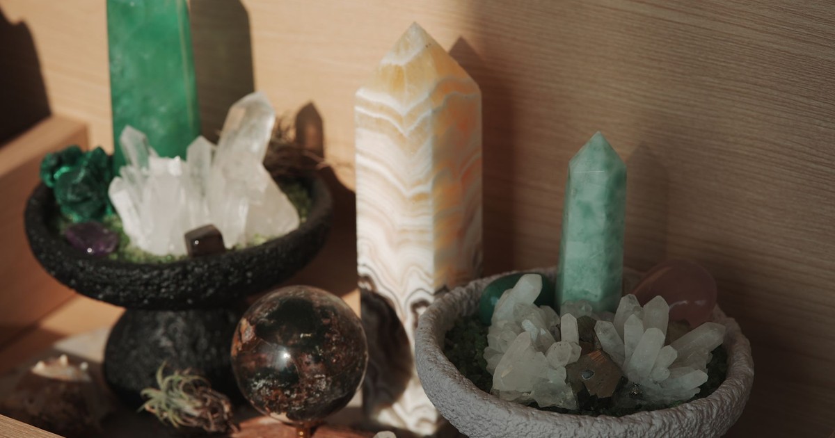 Aesthetic arrangement of crystals and minerals in soft indoor light, showcasing natural beauty.