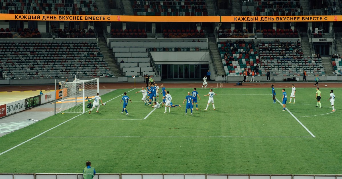 Exciting soccer match captured during day at a modern stadium.