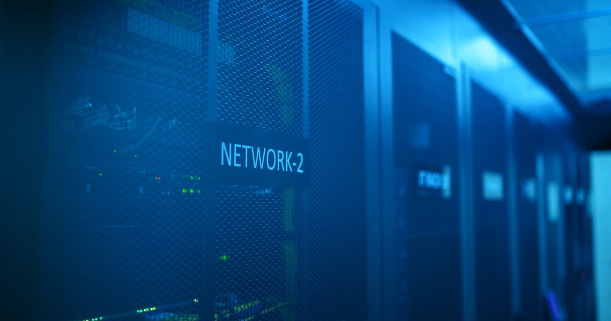 A modern server room featuring network equipment with blue illumination. Ideal for technology themes.