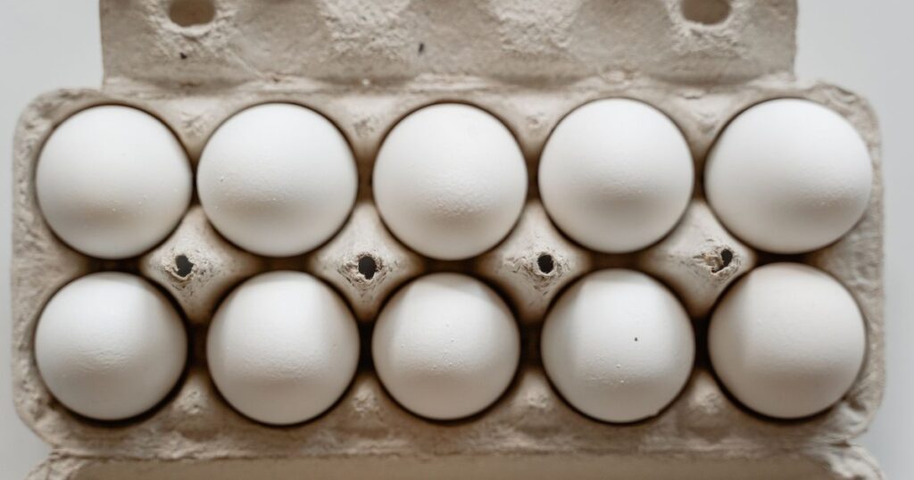 Why Food Experts Say You Should Never Store Eggs Outside Their Carton - Featured image