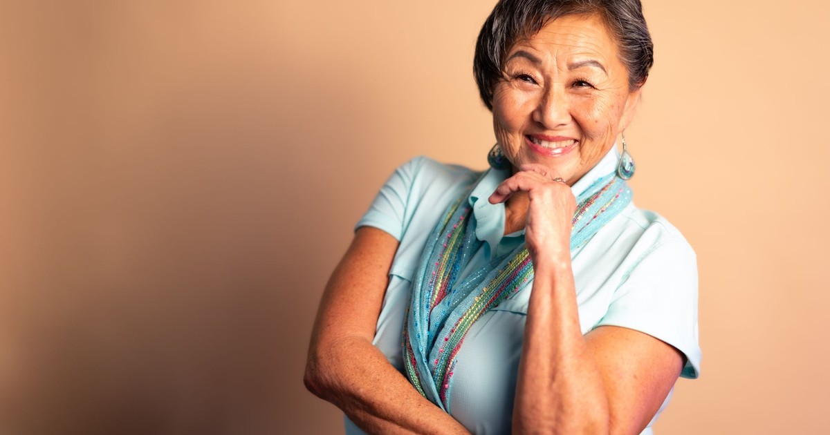 Portrait of a joyful senior woman in Sanford, Florida, showcasing elegance and confidence.