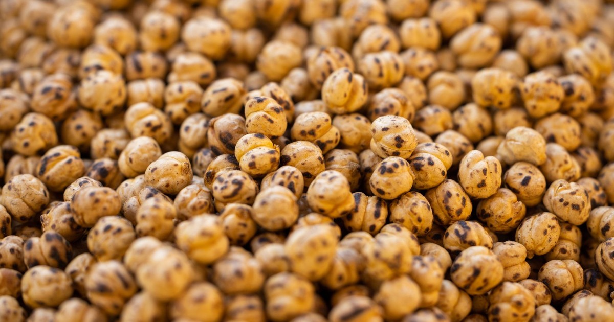 A direct view of roasted chickpeas showcasing their texture and vibrant color, perfect for culinary content.