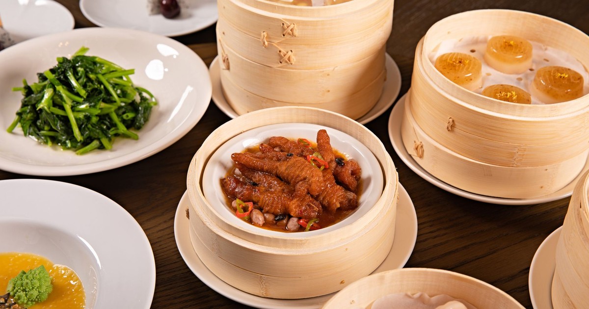 A tantalizing spread of dim sum dishes served in traditional bamboo steamers with a variety of appetizers.
