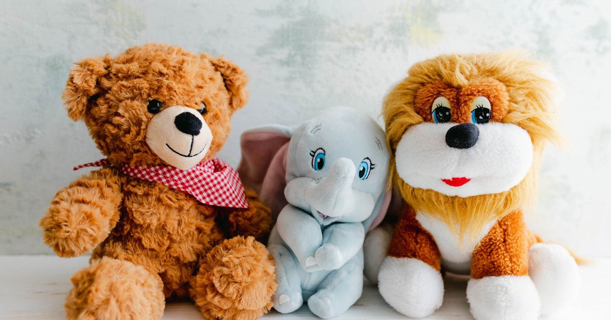 Adorable plush toys featuring a teddy bear, lion, and elephant perfect for children's gifts or decor.