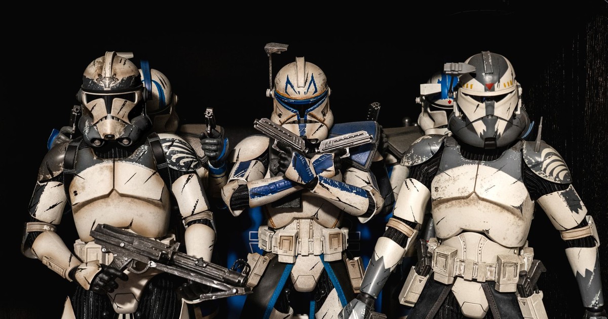 Detailed shot of Star Wars clone trooper action figures in combat-ready stance.