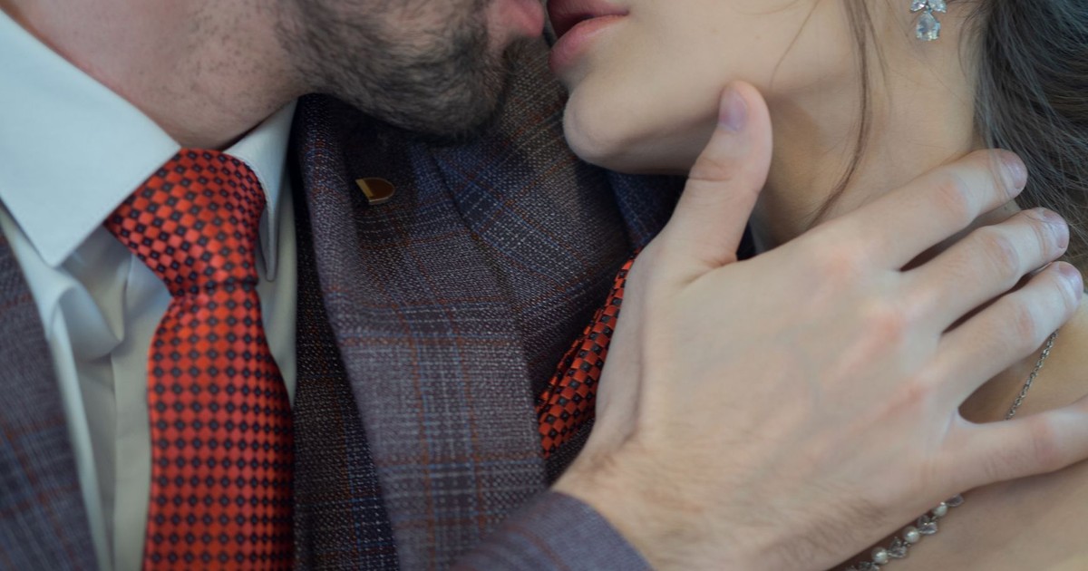 A romantic close-up of a couple kissing, highlighting love and togetherness.