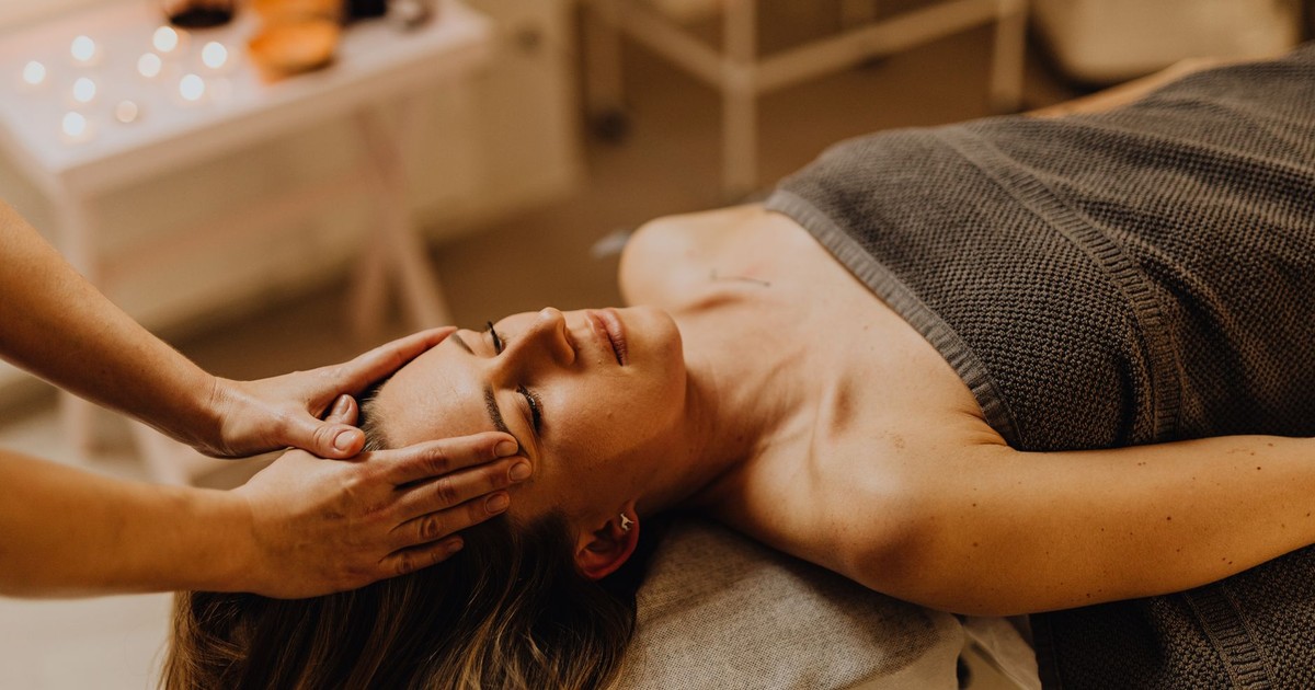 A serene head massage session at a spa, enhancing relaxation and wellness.