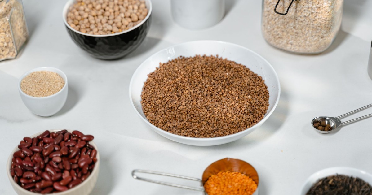A collection of grains and legumes in various bowls and jars, perfect for culinary inspiration.