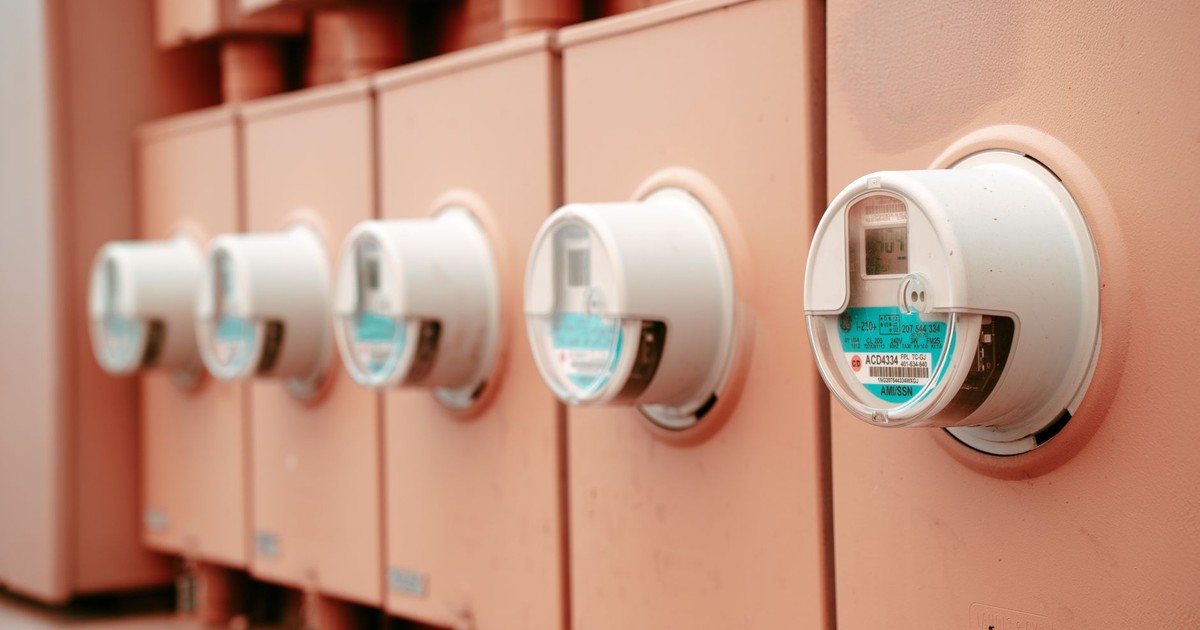 Close-up view of a row of industrial electricity meters for power monitoring and technology.