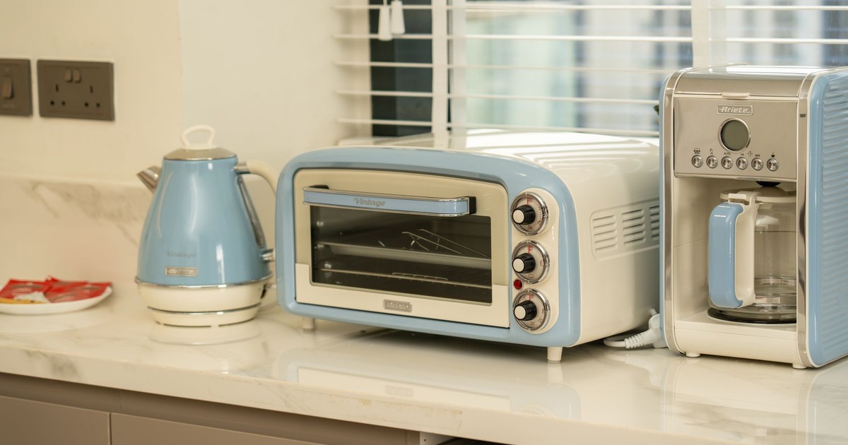 Retro-style kitchen appliances in a modern setting with blue accents.
