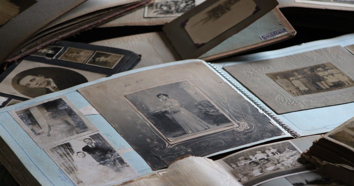 Explore vintage family photo albums filled with black and white photographs, capturing timeless memories.