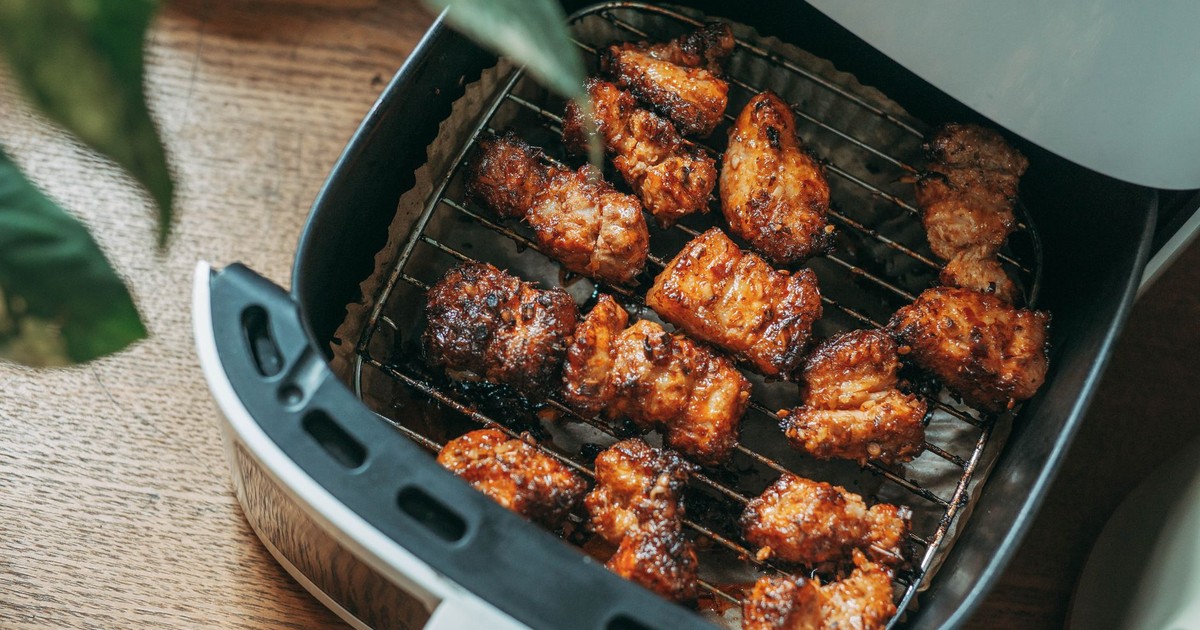 Delicious crispy chicken pieces cooked perfectly in a modern air fryer, ready to serve.