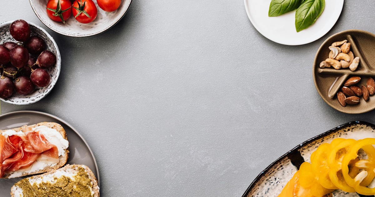 Fresh ingredients with sandwiches in a flat lay style, offering a gourmet meal concept.