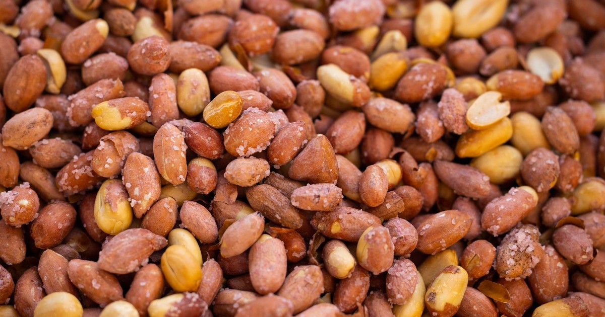 A close-up shot of salted roasted peanuts showcasing texture and seasoning.