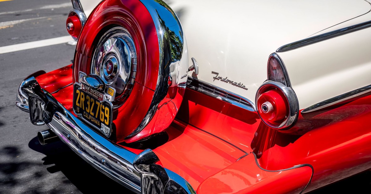 Vintage Ford Fairlane car showcasing its retro design and vibrant colors on a sunny day.