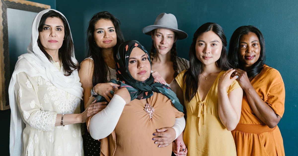 A diverse group of women standing together symbolizing unity, friendship, and empowerment.